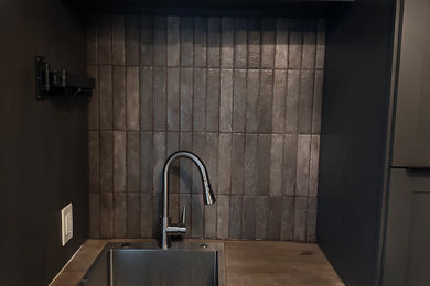 Inspiration for a mid-sized brick floor laundry room remodel in Phoenix with a drop-in sink, shaker cabinets, ceramic backsplash and a side-by-side washer/dryer