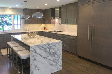 Kitchen - large modern medium tone wood floor and gray floor kitchen idea in New York with an undermount sink, flat-panel cabinets, medium tone wood cabinets, quartzite countertops, white backsplash, stone slab backsplash, stainless steel appliances, an island and white countertops