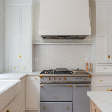 Château Charm: French-Inspired Kitchen Renovation with Plaster Hood Blue Stove a