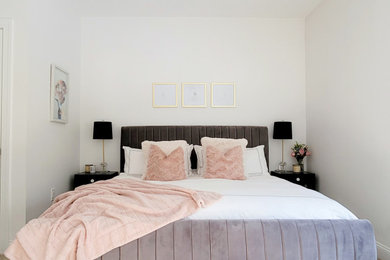 Inspiration for a mid-sized contemporary master carpeted and beige floor bedroom remodel in New York with white walls