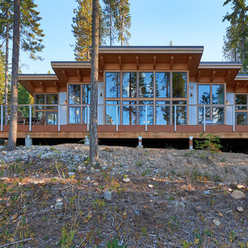 Full view of the north side of the home and wall of windows.