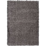 Nourison - Nourison Luxe Shag 9' x 12' Charcoal Shag Indoor Area Rug - This exceptionally plush 2-inch-deep flokati shag rug from the Nourison Luxe Shag Collection has the look and feel of luxuriously soft sheepskin, and makes a perfect addition to any casual room setting. Luxurious texture and deep grey color for a warm, soothing accent.