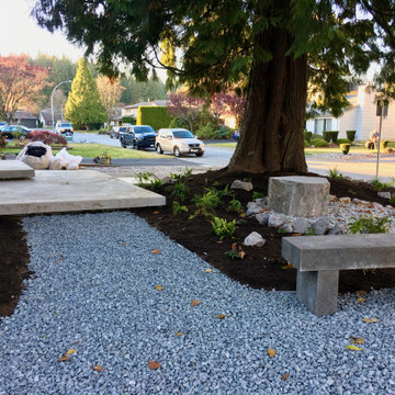 Bench and gravel path leading to front steps