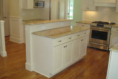 Example of a transitional kitchen design in New York