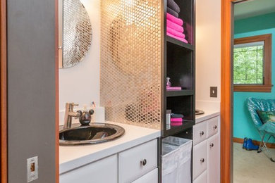 Inspiration for a mid-sized midcentury kids bathroom in Detroit with furniture-like cabinets, white cabinets, mosaic tile floors and a drop-in sink.