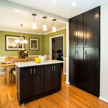 Espresso Kitchen Remodel with Granite Island and Stainless Steel Appliances