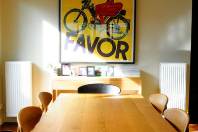 Photo of a contemporary kitchen/dining combo in Melbourne with dark hardwood floors.