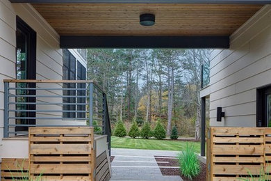 Inspiration for a large contemporary beige one-story house exterior remodel in Chicago