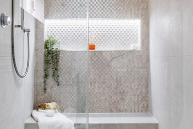 Inspiration for a medium sized contemporary grey and cream ensuite wet room bathroom in Berkshire with flat-panel cabinets, dark wood cabinets, a two-piece toilet, beige tiles, cement tiles, porcelain flooring, an integrated sink, grey floors, a sliding door, double sinks and a built in vanity unit.