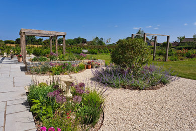 Inspiration for a large rural back formal full sun garden for summer in Other.
