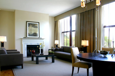 Photo of a large contemporary formal loft-style living room in New York with beige walls, carpet, a standard fireplace, a stone fireplace surround and no tv.