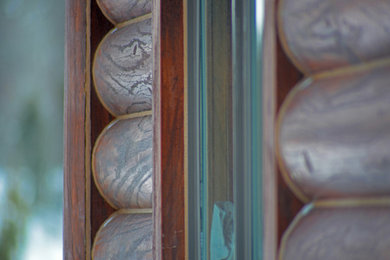 Inspiration for a large rustic brown concrete exterior home remodel in Other