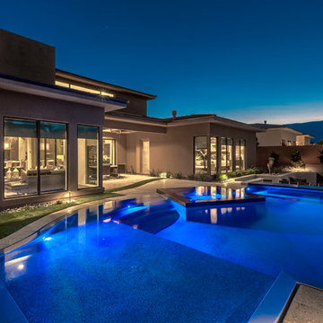 Rim Flow Pool & Spa with Sunken Retreat with BBQ and Glass Walled Fire Pit
