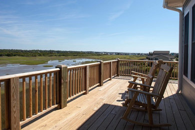 Beach style home design photo in Other