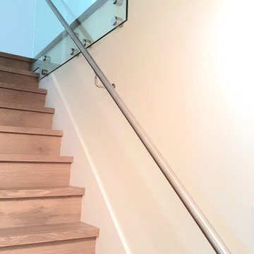 Custom Staircase with Glass Guardrail – Upper Lonsdale Full Home Renovation