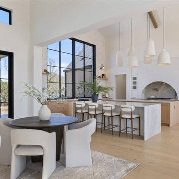 Open Kitchen and Dining with Vaulted Ceilings and Natural Light