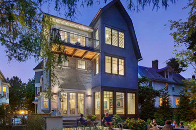 Example of a mid-sized transitional white three-story stucco exterior home design in Philadelphia with a shingle roof
