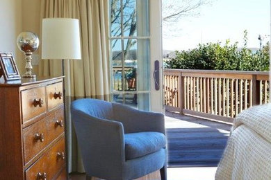 Mid-sized beach style master dark wood floor bedroom photo in New York with beige walls