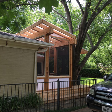 Playful roof lines and built around a beautiful Bradford Pear