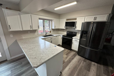 Inspiration for a mid-sized transitional u-shaped eat-in kitchen remodel in Other with shaker cabinets, white cabinets and laminate countertops