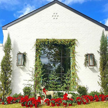 White Brick Exterior Dressed for the Holidays with Modernist Lanterns