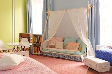 This is an example of a large traditional gender-neutral kids' bedroom for kids 4-10 years old in Paris.