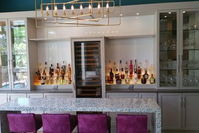Inspiration for a modern home bar in Miami.