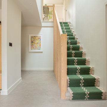 Loughton House Concrete Stairs with Green Stair Runner and Bespoke Joinery in Ha