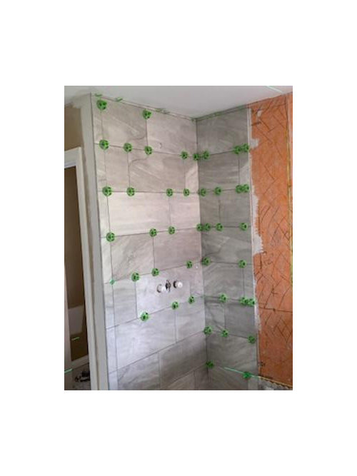 How to handle uneven ceiling and tile in a shower