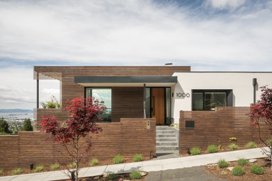 Example of a minimalist white one-story exterior home design in San Francisco