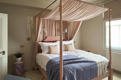 Inspiration for a medium sized teen’s room for girls in London with beige walls, carpet, beige floors and feature lighting.