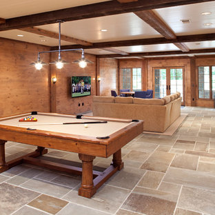 Design ideas for a rustic walk-out basement in Minneapolis with brown walls and slate flooring.