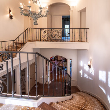 Traditional Curving Staircase with Chandelier