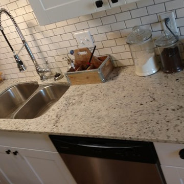 2 cm Dallas White granite with white subway tile -remodel Roland Ok.