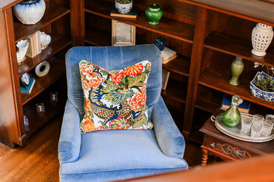 Example of a mid-sized classic medium tone wood floor entryway design in Indianapolis with blue walls