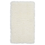 Nourison - Nourison Luxe Shag 2'2" x 3'9" Ivory Shag Indoor Area Rug - This exceptionally plush 2-inch-deep flokati rug from the Nourison Luxe Shag Collection has the look and feel of luxuriously soft sheepskin, and makes a perfect addition to any casual room setting. Luxurious texture and soft ivory color for a warm, soothing accent.