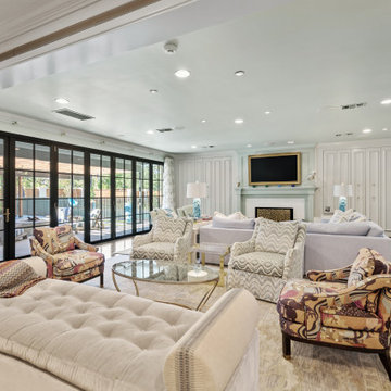 Spacious and Elegant Living Room with Floor-to-Ceiling Windows and Vibrant Patte