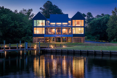 Example of a minimalist blue two-story house exterior design in Richmond