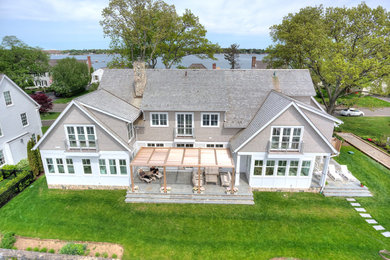 Mid-sized transitional gray two-story mixed siding exterior home idea in New York with a shingle roof