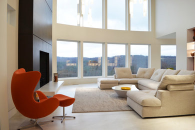 Example of a large minimalist formal and open concept porcelain tile living room design in New York with a two-sided fireplace and a stone fireplace