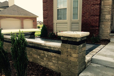 This is an example of a traditional partial sun backyard brick landscaping in Detroit.