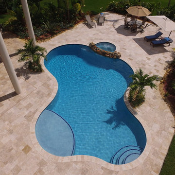 Free Form Swimming Pool with natural rock spillover