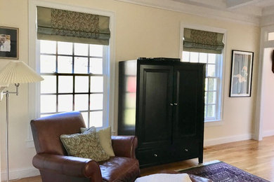 Example of a transitional family room design in Boston