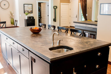 Inspiration for a mid-sized transitional l-shaped dark wood floor and brown floor eat-in kitchen remodel in San Diego with an undermount sink, shaker cabinets, dark wood cabinets, marble countertops, beige backsplash, ceramic backsplash, stainless steel appliances, an island and brown countertops