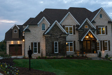 Example of a transitional exterior home design in Raleigh