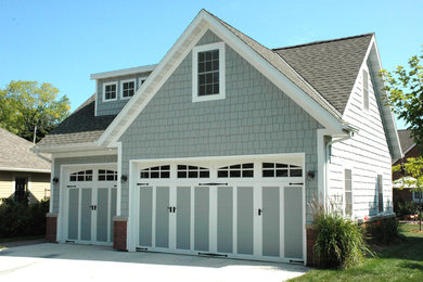 Example of an arts and crafts garage design in Milwaukee