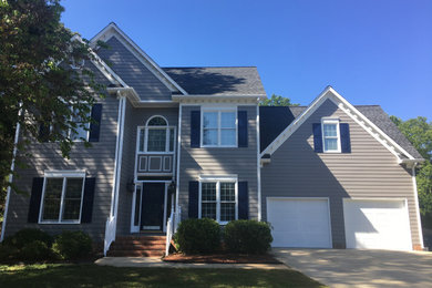 Example of a gray exterior home design in Raleigh