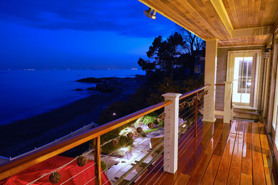 Mid-sized trendy backyard deck photo in Boston with a roof extension