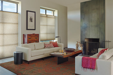 Inspiration for a mid-sized transitional open concept living room in Portland with beige walls, dark hardwood floors, a standard fireplace and a concrete fireplace surround.