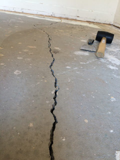 Crumbling concrete flooring under carpet - General Inspection